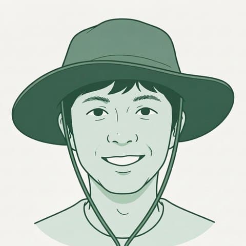 押田竜太の似顔絵。つば広の帽子をかぶって笑っている